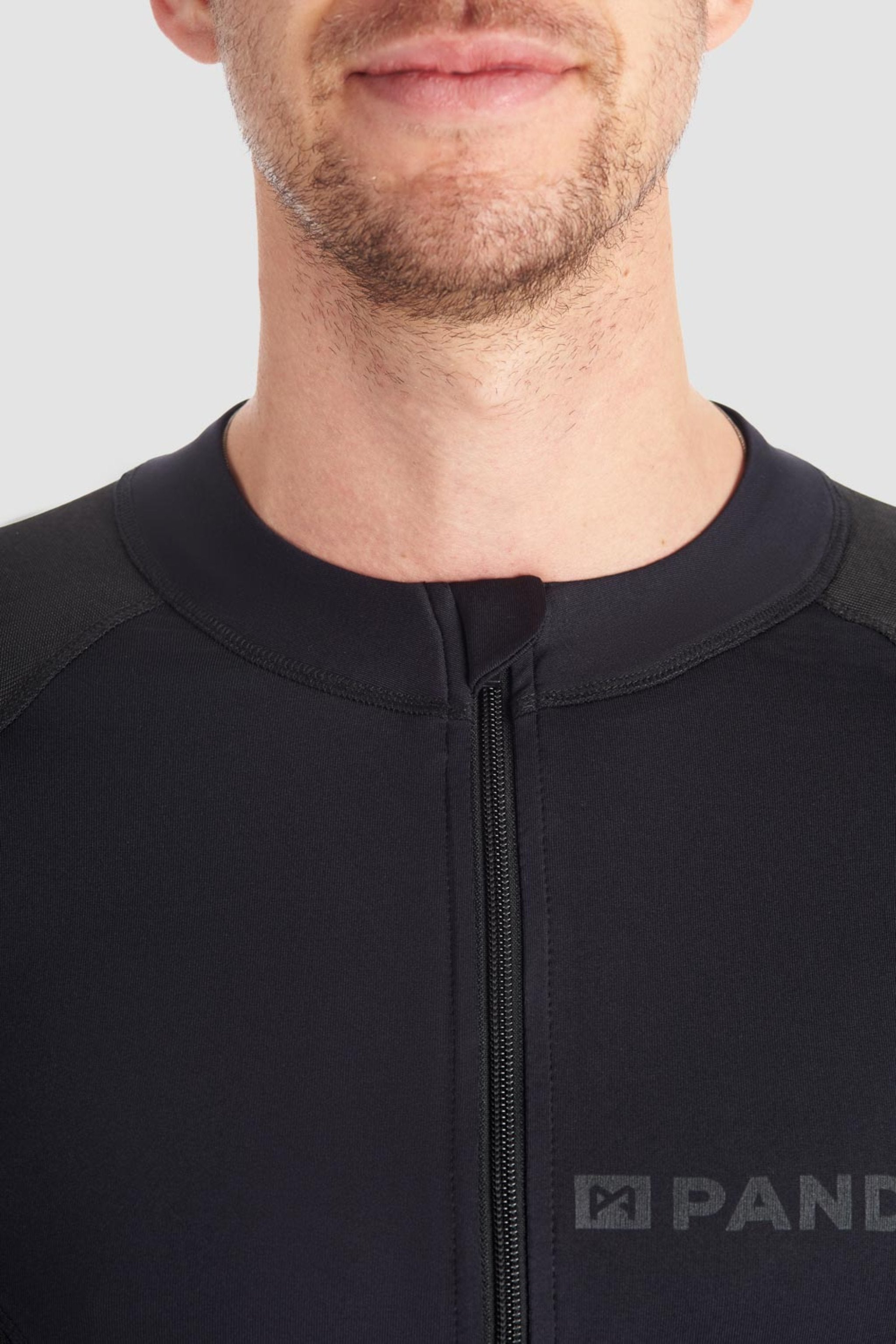 a man wearing Pando Moto black base layer shirt