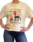 a woman wearing off white/creame colour t-shirt with retro motive that says No bullshit