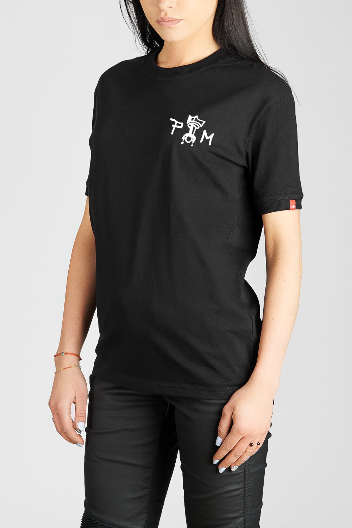 A woman  wearing black Pando Moto women's motorcycle t-shirt with Pando Moto logo