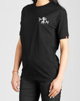 A woman wearing black Pando Moto women's motorcycle t-shirt with Pando Moto logo