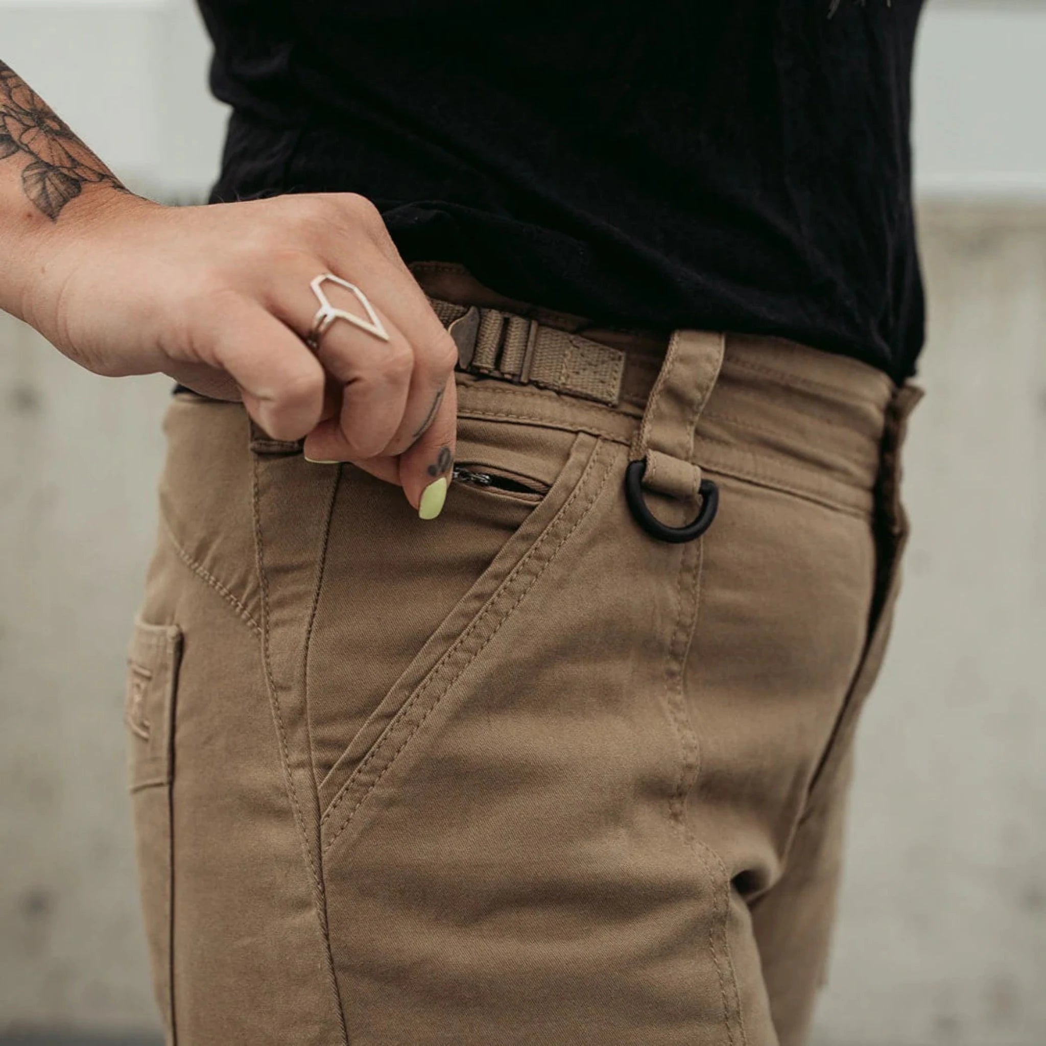 A close up of the pockets on beige women's motorcycle cargo pants from mOTO gIRL