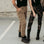 Women legs wearing beige and camo motorcycle cargo pants Lara from moto Girl