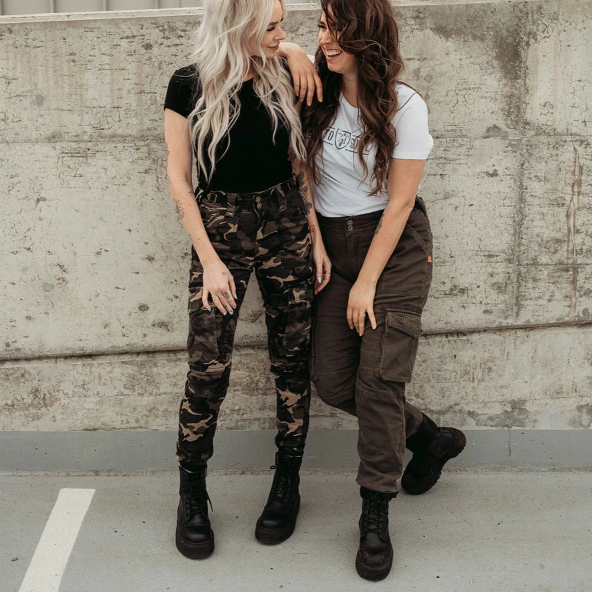 Two young women wearing motorcycle cargo pants from Moto girl