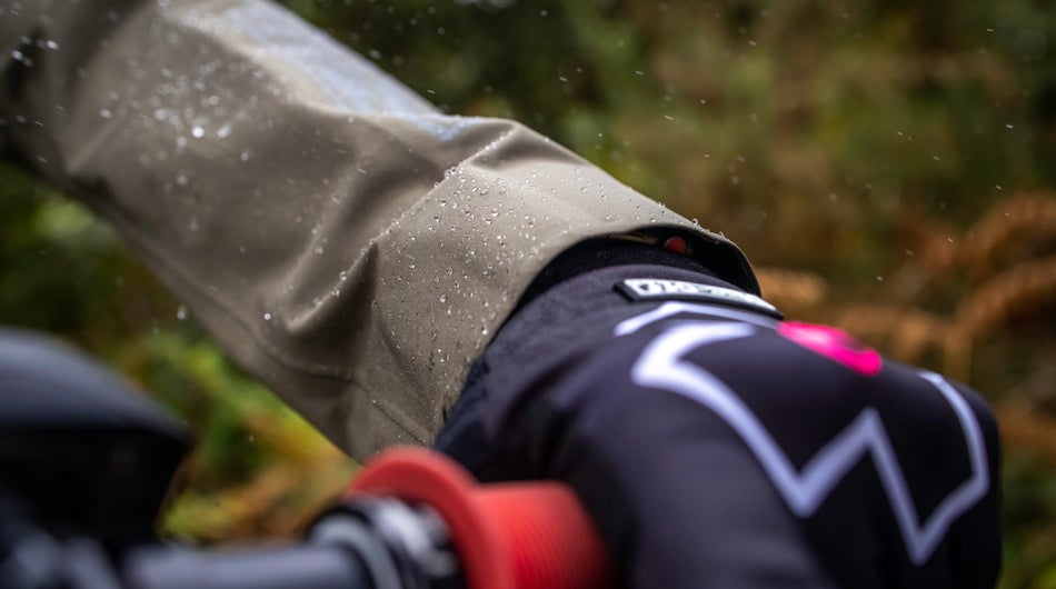 Rain drops on a motorcycle drivers hand