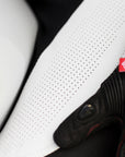 A close up of the material of Women's racing suit MIURA RS in black, white and fluo from Shima