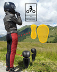 A woman wearing black and red women's motorcycle leggings from exagon66