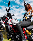 A woman on a motorcycle wearing black women's motorcycle leggings from exagon66