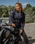 red hair woman sitting on her motorcycle wearing Blue and black women motorcycle mesh jacket from MotoGirl 