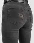 Black jeans with a visible brand logo on the back pocket against a white background