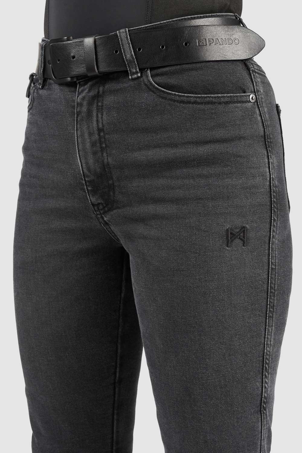 Black jeans with a belt and visible brand logo on a light gray background