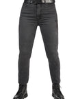 Black jeans with a belt and black boots on a white background