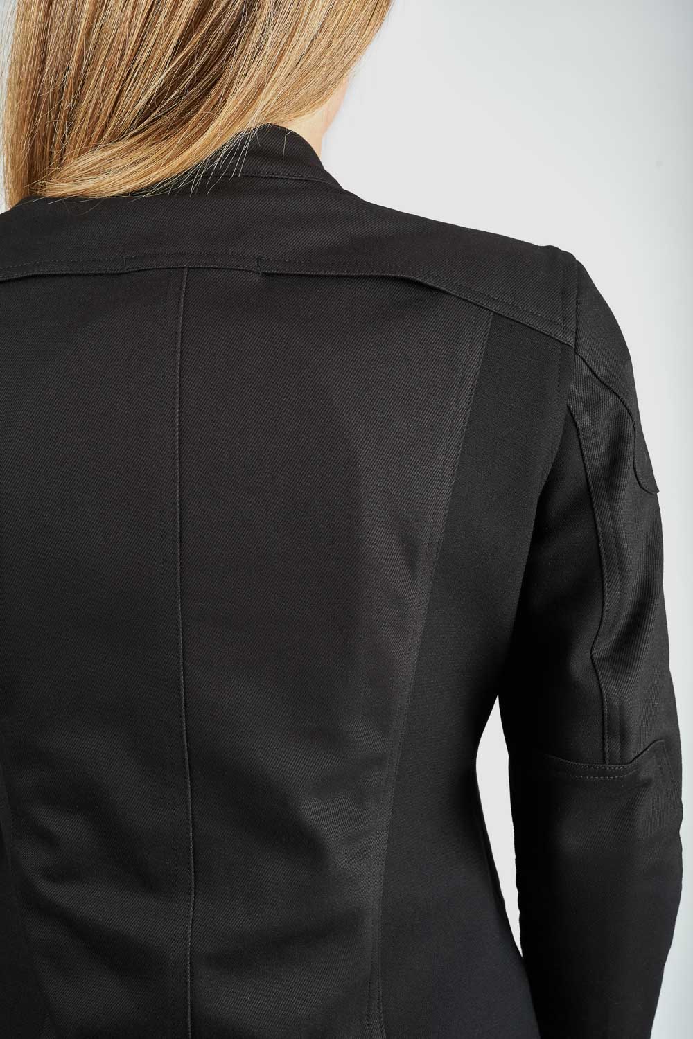 Black jacket worn by a person on a white background