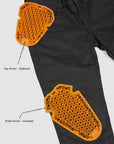 Black motorcyle pants with orange knee and hip armor on a white background