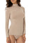 woman wearing a turtle neck beige top from modal material