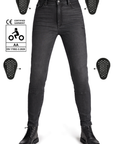 Black jeans with protective patches on a white background