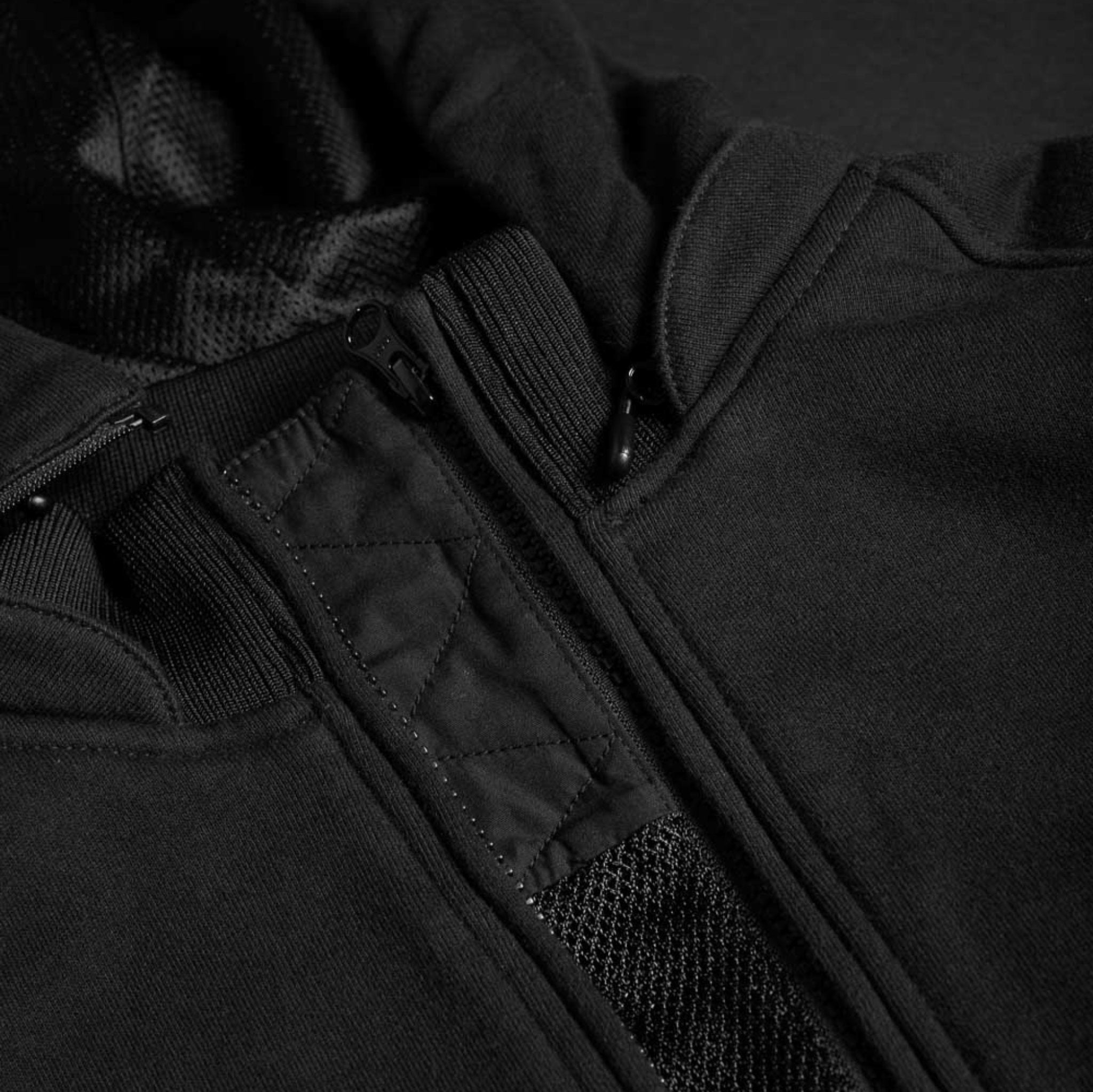 Close up of a zipper from a black Motorcycle hoodie from Pando Moto