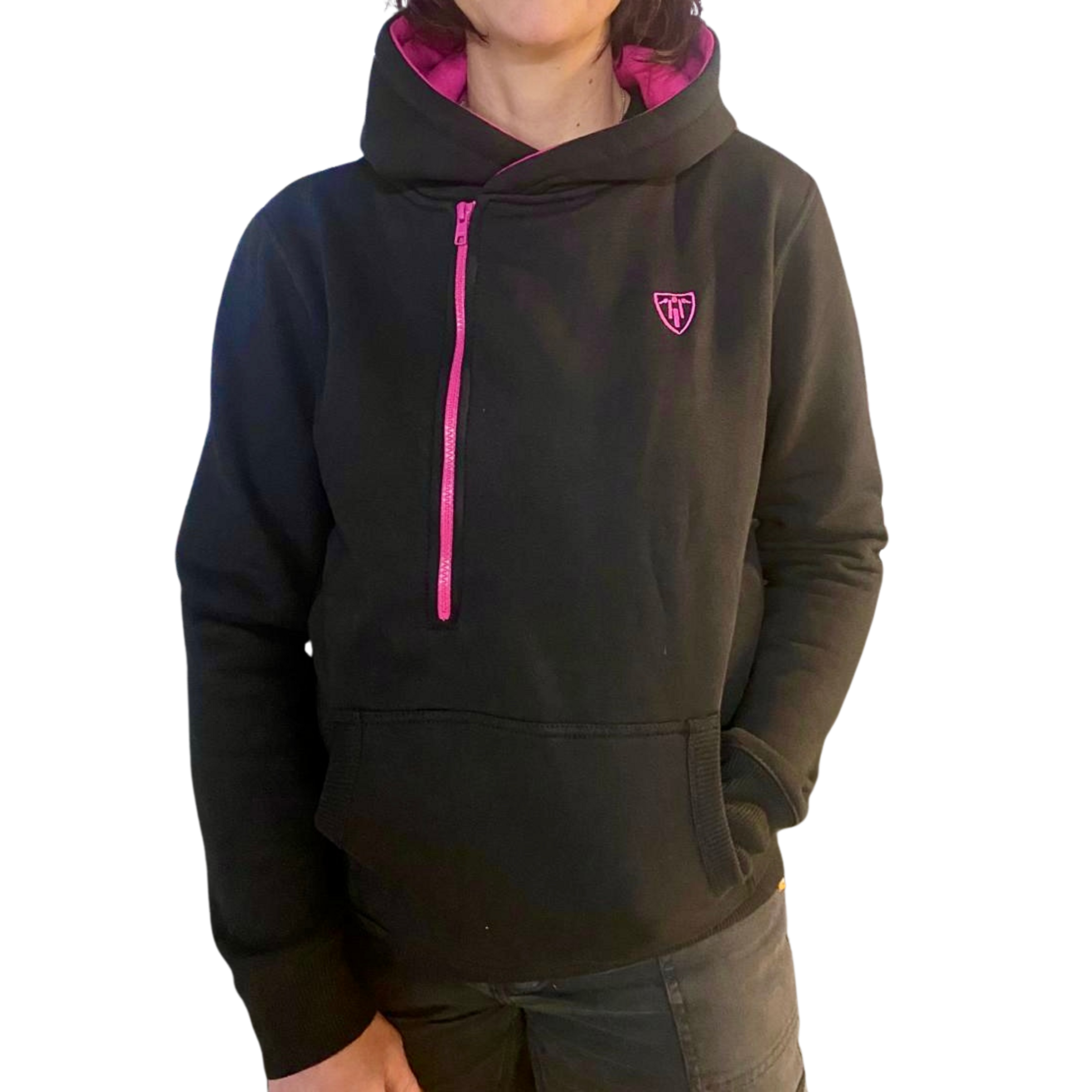 A woman wearing black Moto Girl helmet hoodie with pink details and front zipper 