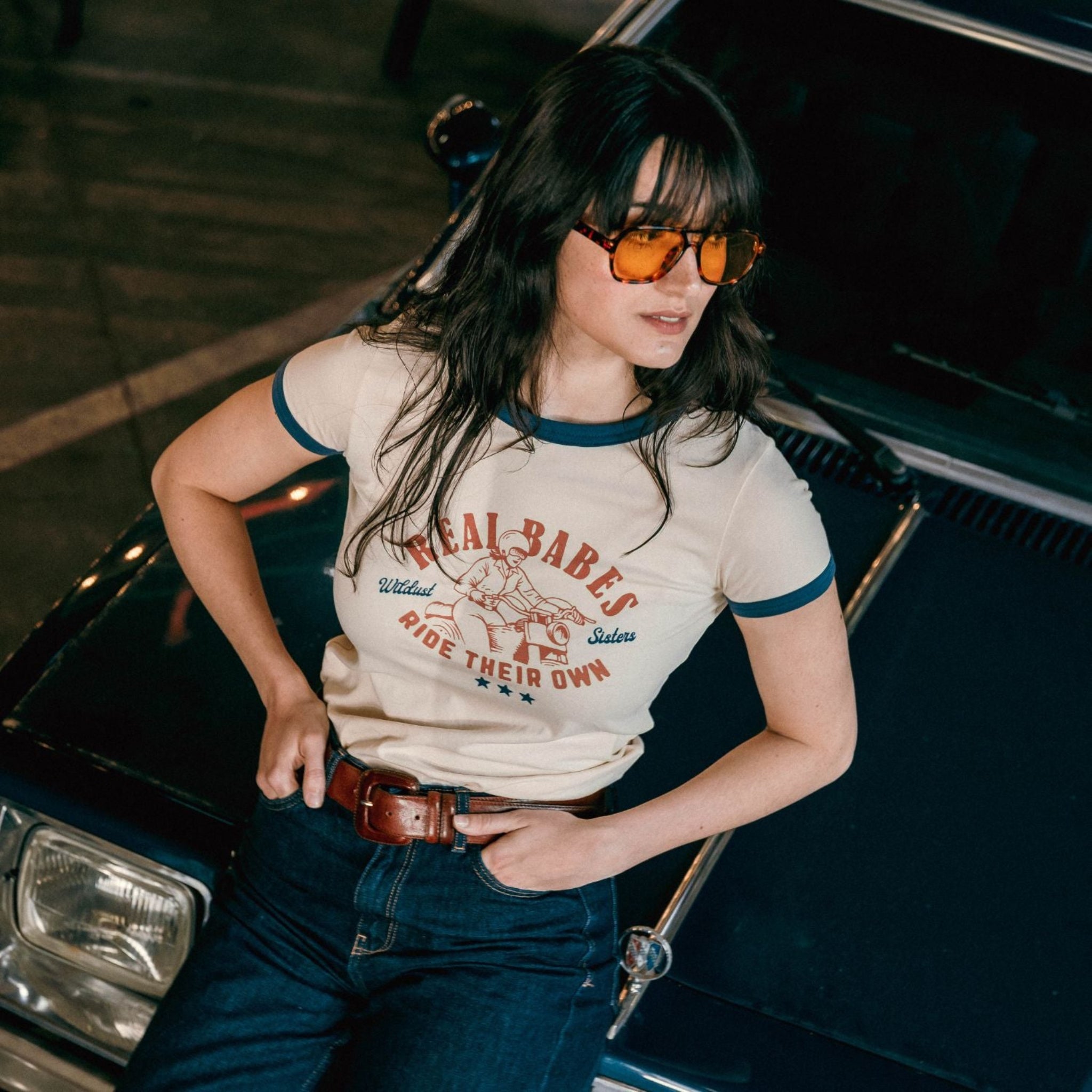 young dark haired woman wearing REAL BABES RIDE THEIR OWN retro style t-shirt