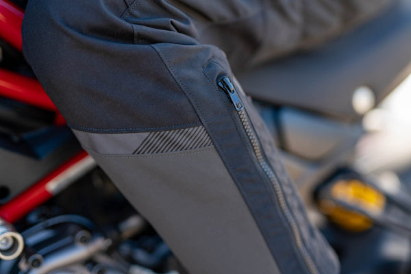 A close up of leg zipper on the women motorcycle touring pants