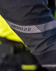 A close up of the HERO 2.0 reflective panel on the shima motorcycle touring jacket for women in black/ fluo