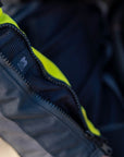 A close up of the sleeve zip on the shima motorcycle touring jacket for women in black/ fluo
