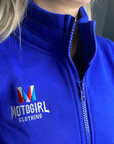 close up of woman's neck wearing Motogirl clothing blue sweatshirt with a front zip