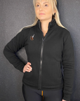 a blond woman wearing black sweatshirt with a zip and MotoGirl embroidery