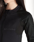 A woman wearing black tight motorcycle underwear with Pando Moto Logo