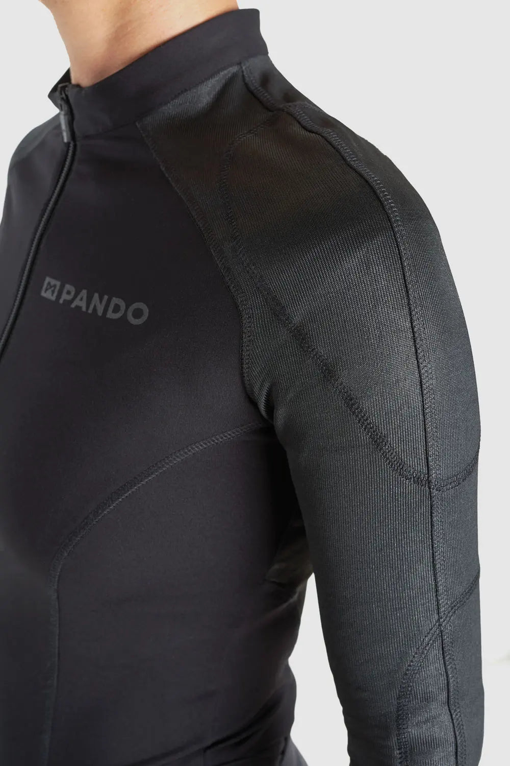 A close up of the shoulder of Pando Moto Armored motorcycle long-sleeve bodysuit base layer for women