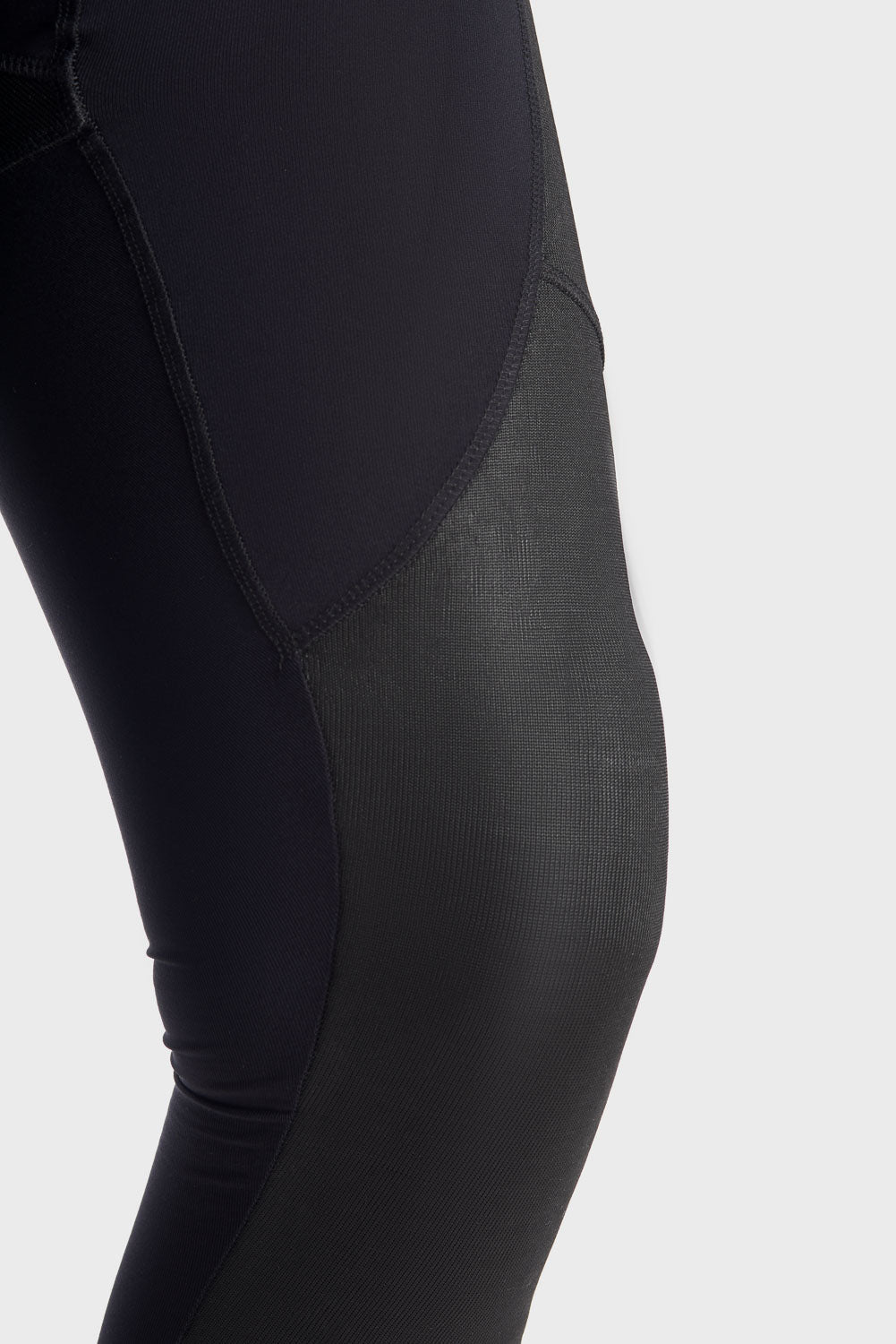 A close up of the knee  wearing Pando Moto SKIN AAA armoured base layer leggings in black