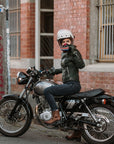 A woman on her motorcycle wearing brown leather mc shoes