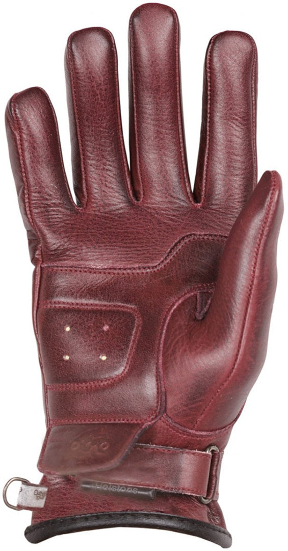 A palm of a dark red lady motorcycle glove