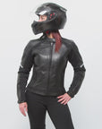 A woman posing wearing Black leather women's motorcycle jacket with reflectors from Moto Girl 