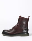 a Women's motorcycle boot in burgundy from John Doe from the side