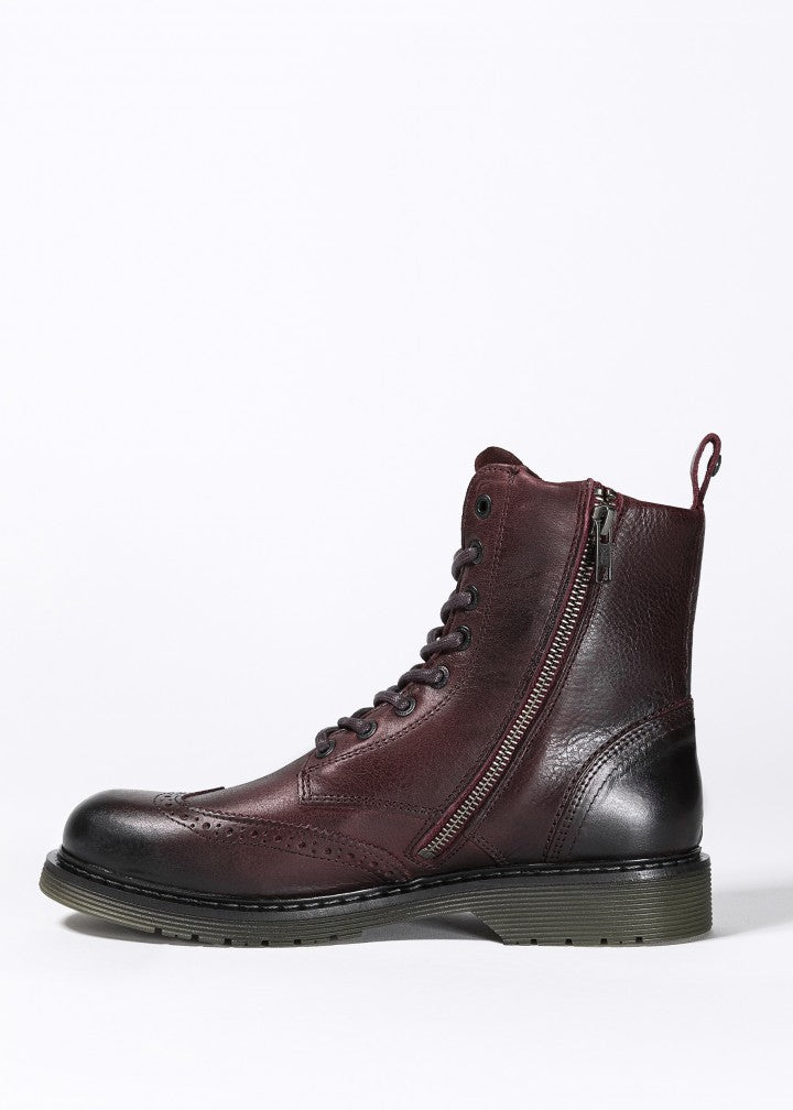 A Women&#39;s motorcycle boot in burgundy from John Doe from the side