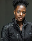 a black woman wearing black difi motorcycle jacket