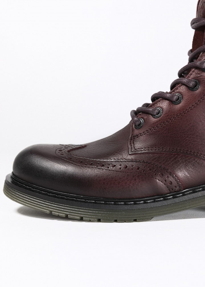 A close up of a toe of Women&#39;s motorcycle boot in burgundy from John Doe