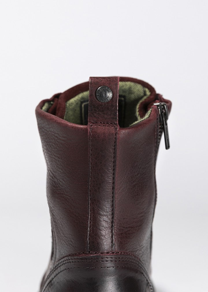 a close up of details of Women&#39;s motorcycle boots in burgundy from John Doe