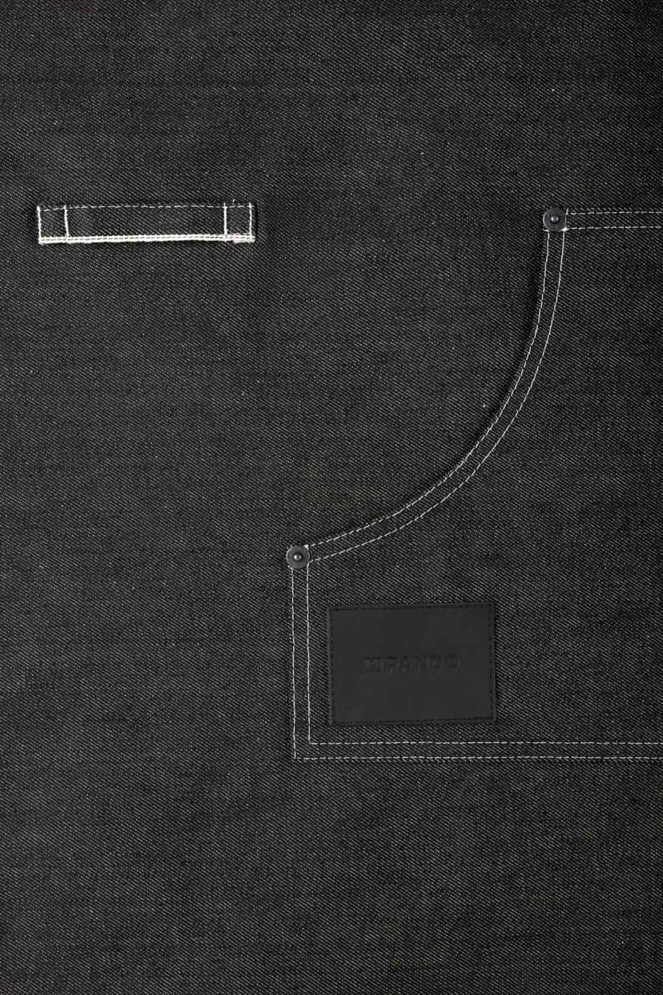 A close up of a pocket of a black denim apron Pando Moto 