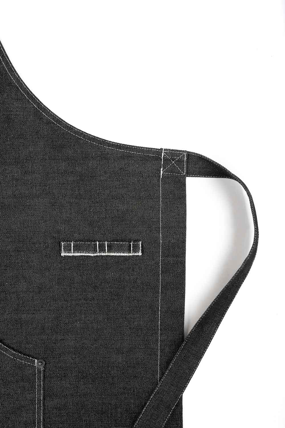 A close up of a stripe of Black denim apron Pando Moto 