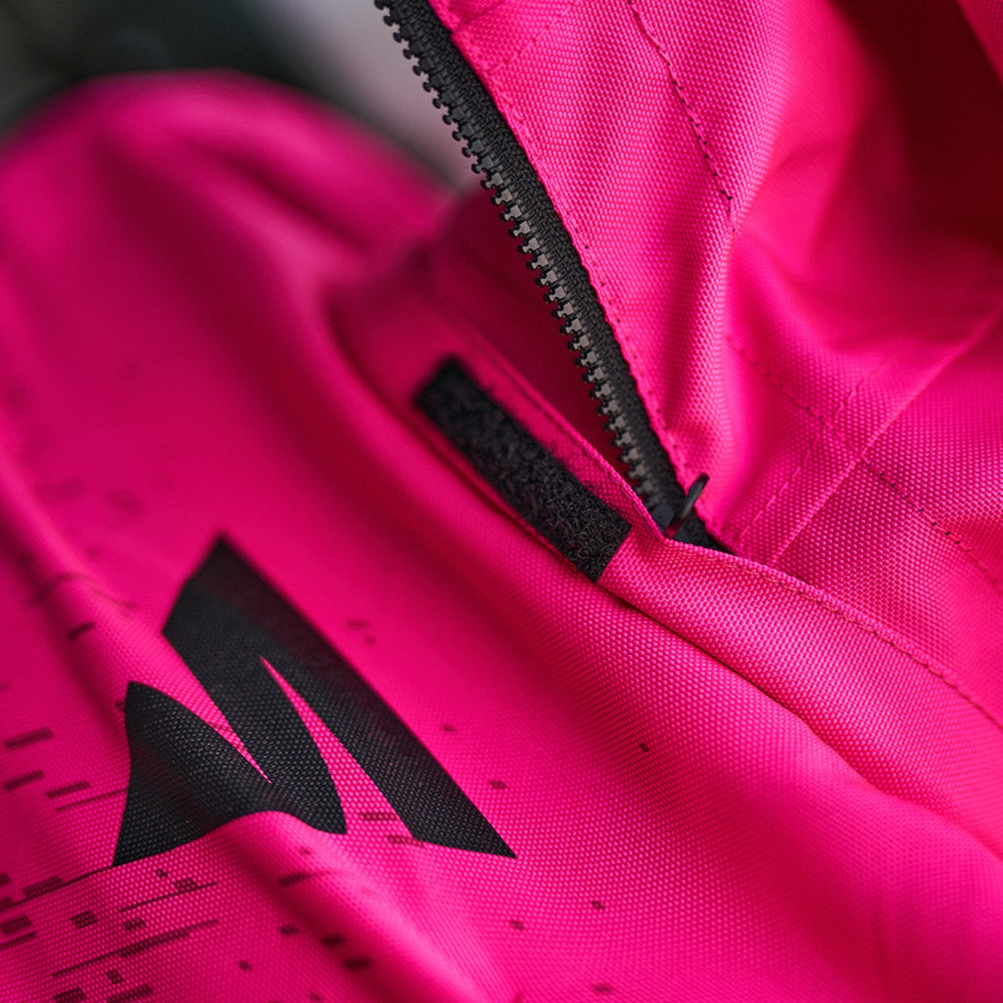 A close up of the zipper on the pink motorcycle jacket from Shima