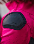 A close up of the slider on the pink DRIFT  motorcycle jacket from Shima