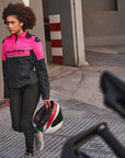 A young woman pink DRIFT  motorcycle jacket from Shima