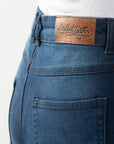 Close up of woman's waist wearing lady blue motorcycle jeans
