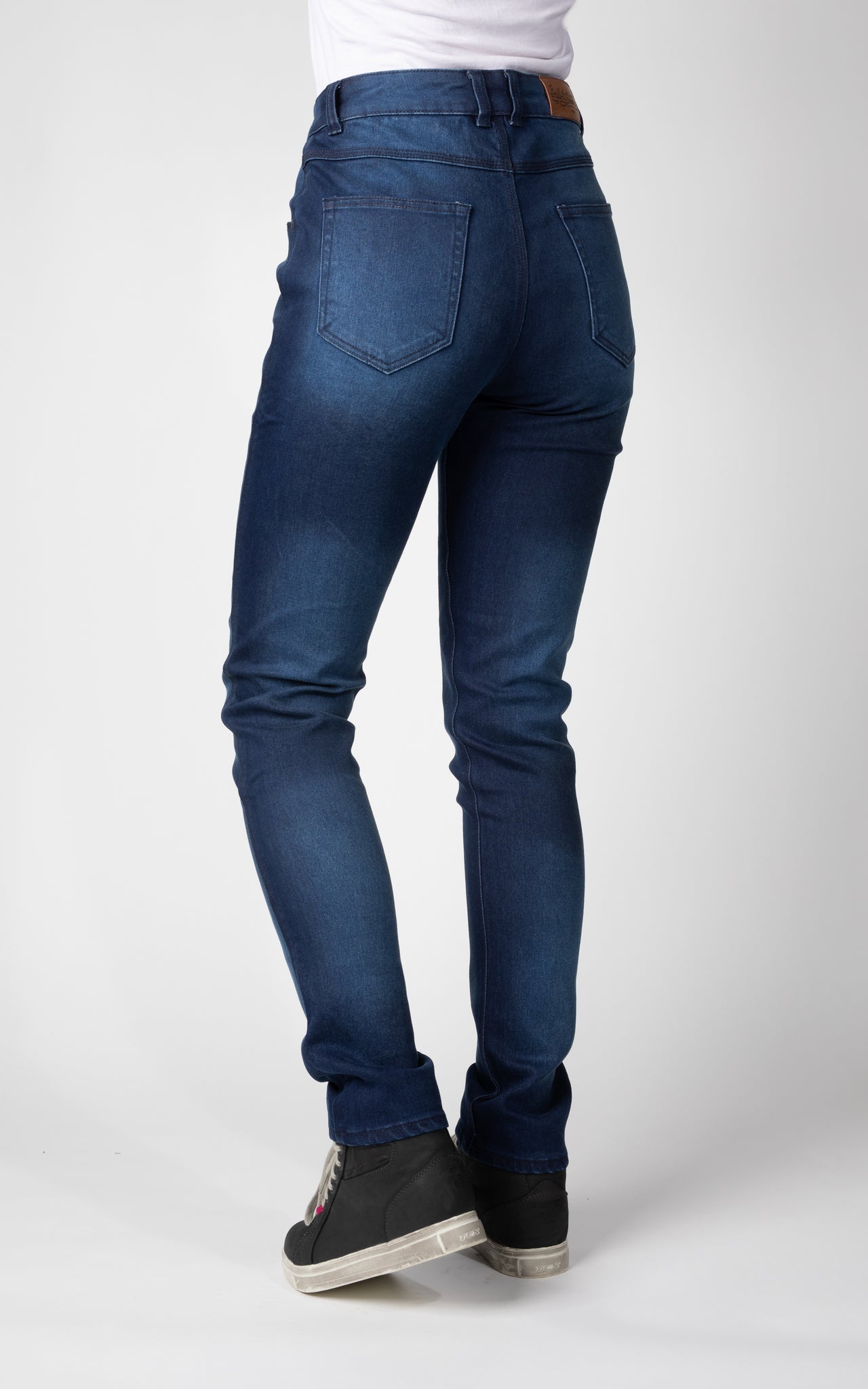 Woman&#39;s legs from behind wearing blue lady motorcycle jeans from Bull-it