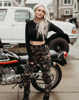 A young blond woman wearing women camouflage motorcycle cargo pants from Moto Girl  