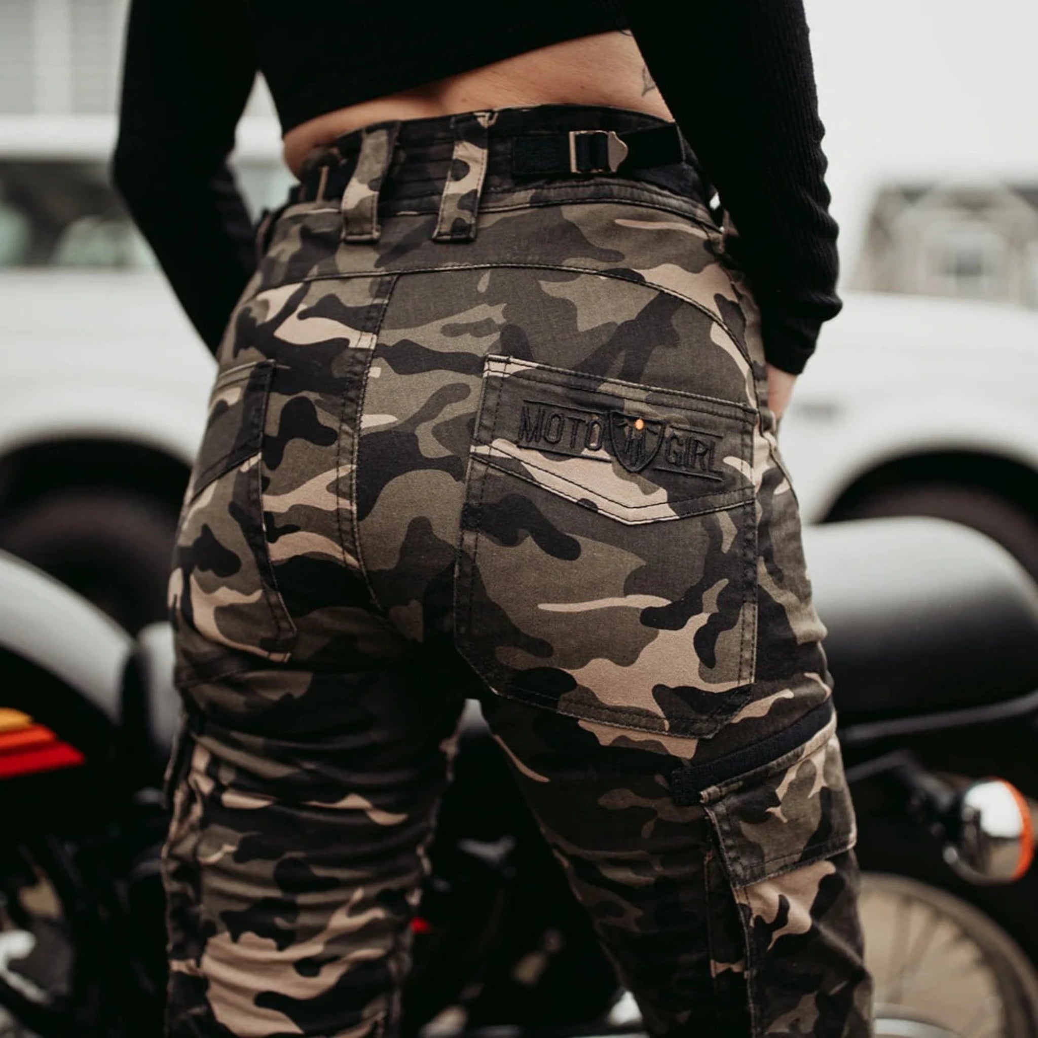 A woman's bottom wearing  camouflage motorcycle cargo pants from Moto Girl  