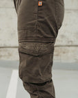 A close up of the pocket on olive green women's motorcycle pants from Motogirl