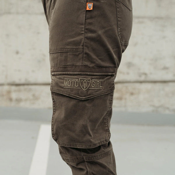 A close up of the pocket on olive green women's motorcycle pants from Motogirl