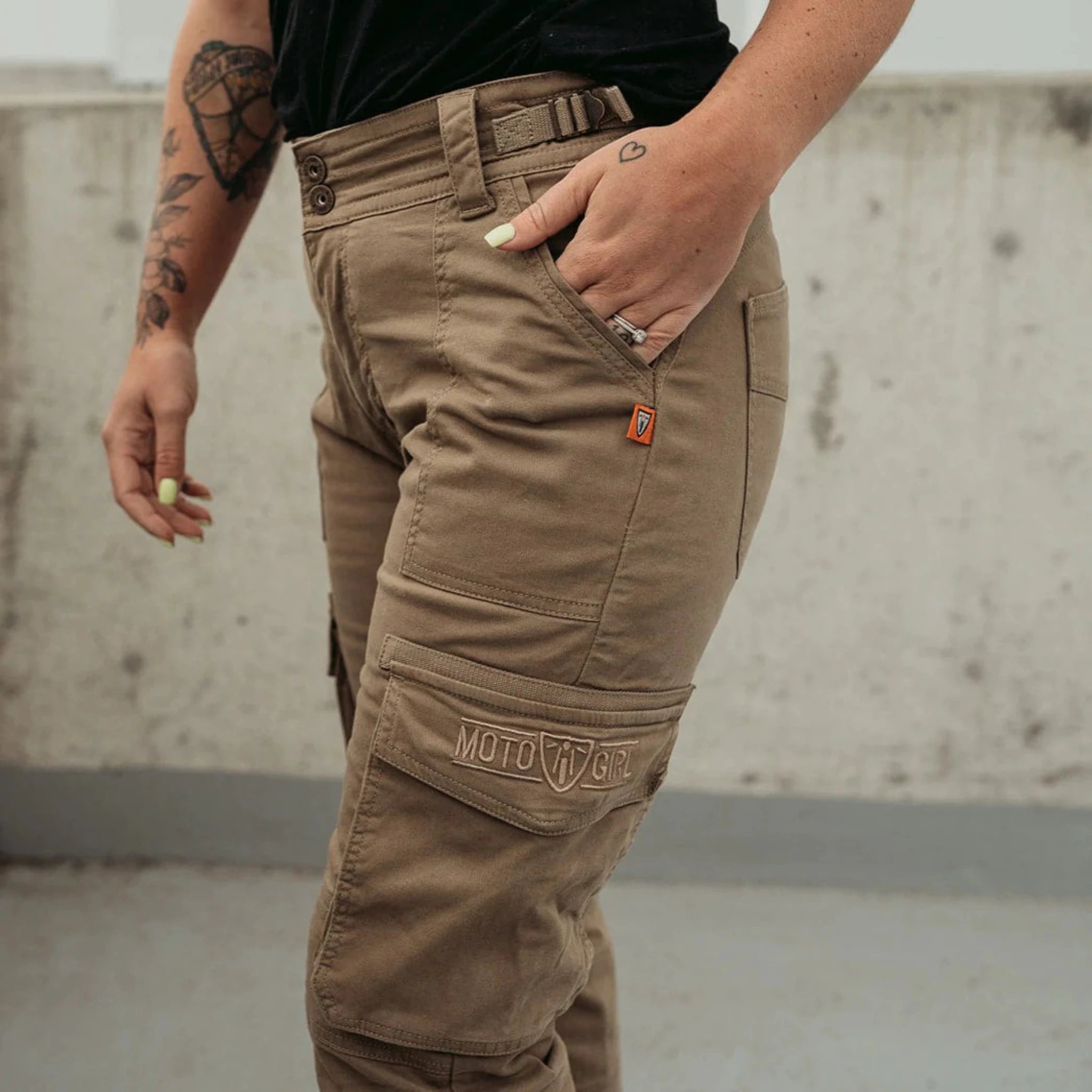 Woman's leg wearing beige motorcycle cargo pants from Moto Girl 